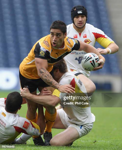 Rangi Chase of Castleford Tigers is tackled by Sataimata Sa and Casey McGuire of Catalan Dragons during the Engage Rugby Super League Magic Weekend...