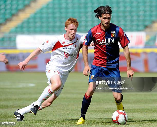 Alessandro Gazzi of Bari and Robert Acquafresca of Genoa compete for the ball during the Serie A match between Bari and Genoa at Stadio San Nicola on...