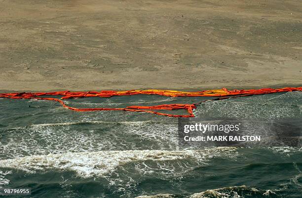 Oil boom barriers that are expected to stop the spread of oil from the BP Deepwater Horizon platform disaster, lies washed up on the beach after...