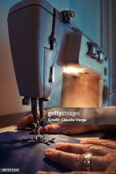 hands at a sewing machine. - verga stock pictures, royalty-free photos & images