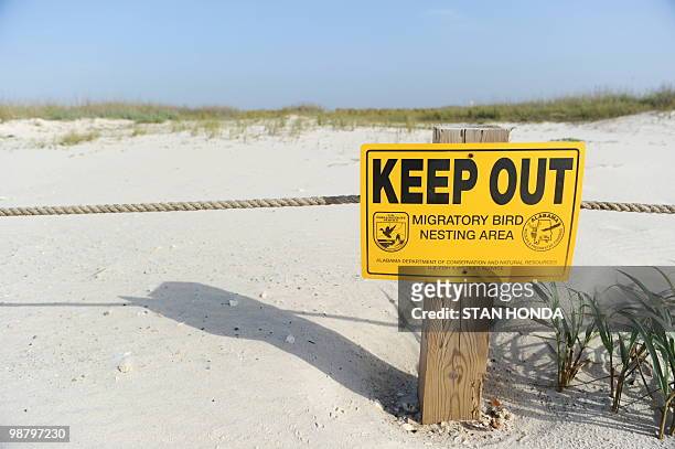 Sign identifying a migratory bird nesting area on Dauphin Island, Alabama, May 2 off the coast of Mobile, as the oil spill from the BP Deepwater...