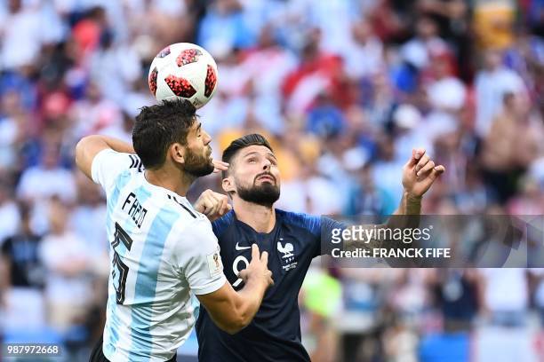Argentina's midfielder Lucas Biglia vies with France's forward Olivier Giroud during the Russia 2018 World Cup round of 16 football match between...