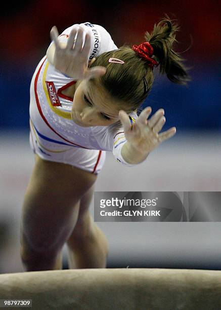 Romania's Elena Amelia Racea reacts after performing on the vault during the women seniors apparatus final, in the European Artistic Gymnastics...