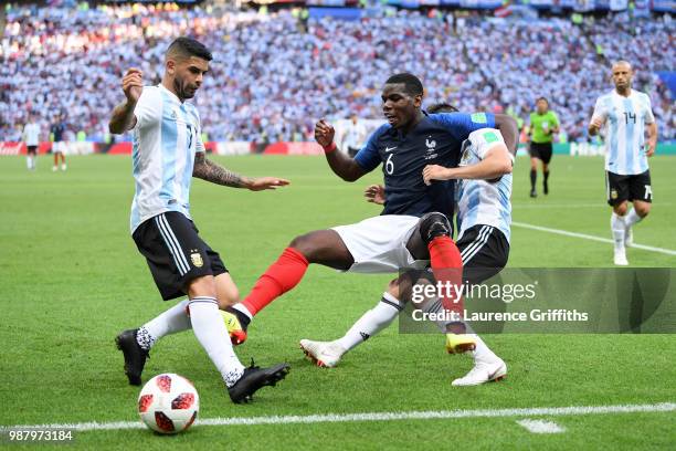 Paul Pogba of France is challenged by Nicolas Tagliafico of Argentina during the 2018 FIFA World Cup Russia Round of 16 match between France and...