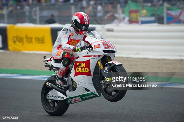 Marco Simoncelli of Italy and San Carlo Honda Gresini lifts the front wheel at the end of the MotoGP race at Circuito de Jerez on May 2, 2010 in...