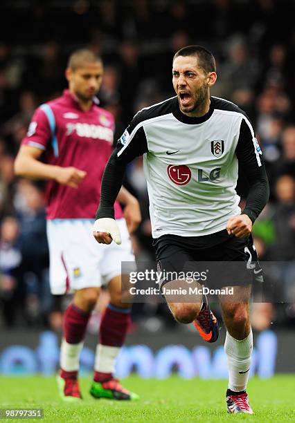 Clint Dempsey of Fulham celebrates as he scores their first goal during the Barclays Premier League match between Fulham and West Ham United at...