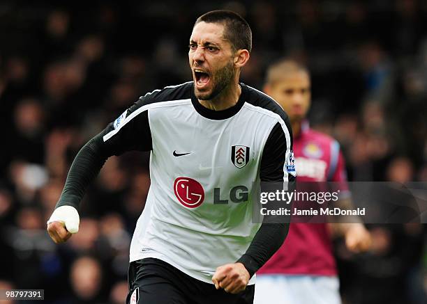 Clint Dempsey of Fulham celebrates as he scores their first goal during the Barclays Premier League match between Fulham and West Ham United at...