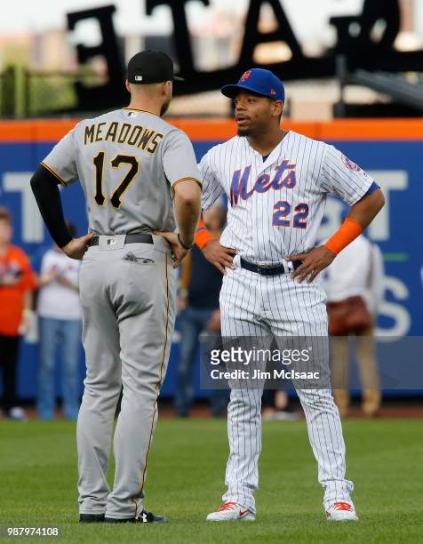 Dominic Smith of the New York Mets and Austin Meadows of the Pittsburgh Pirates talk prior to their game at Citi Field on June 26, 2018 in the...