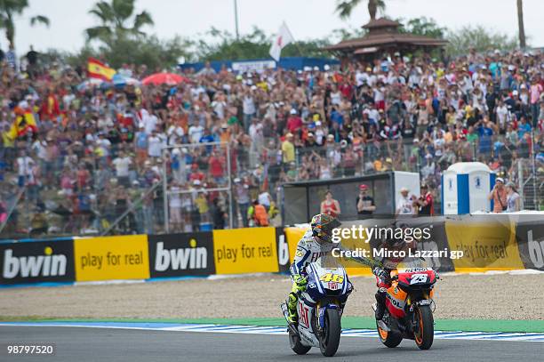 Valentino Rossi of Italy and Fiat Yamaha Team congratulates with Dani Pedrosa of Spain and Repsol Honda Team at the end of the MotoGP race at...