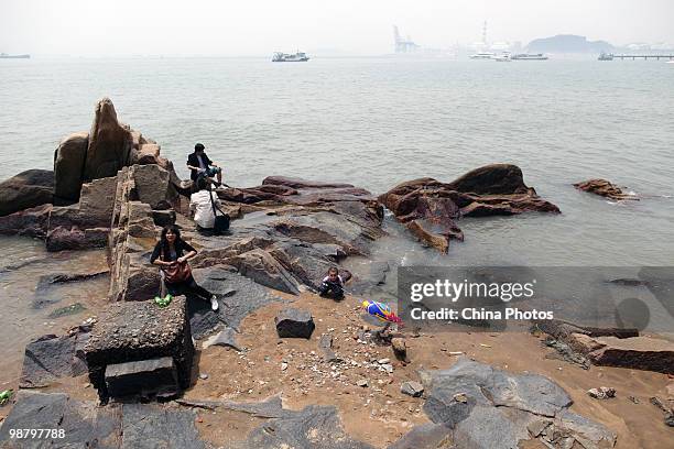 Tourists visit Gulangyu, a car-free island renowned for its natural beauty, on May 1, 2010 in Xiamen of Fujian Province, southeastern China. The...