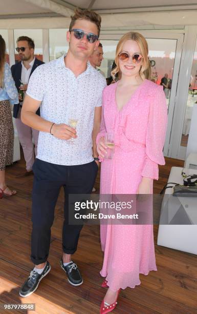 Jeremy Irvine and Cara Theobold attend the Audi Polo Challenge at Coworth Park Polo Club on June 30, 2018 in Ascot, England.