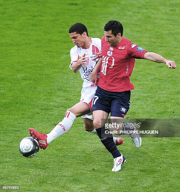 Lille's French forward Pierre-Alain Frau vies with Nancy's defender Mickael Chretien during their French L1 football match Lille vs Nancy on May 02,...