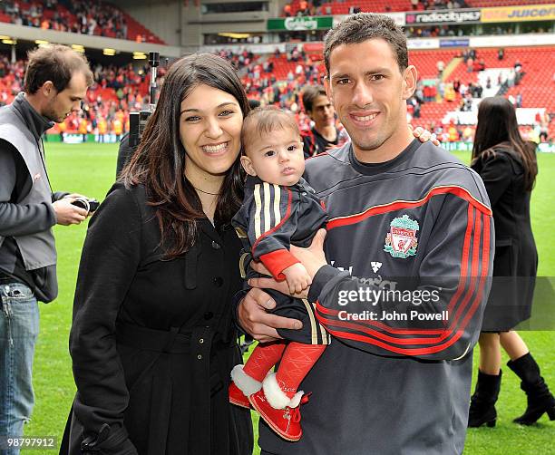 Maxi Rodriguez of Liverpool walks round Anfeild with his children at the end of the Barclays Premier League match between Liverpool and Chelsea at...