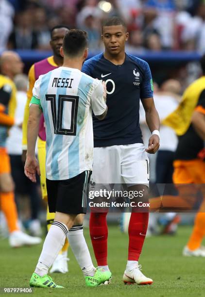 Kylian Mbappe of France consoles Lionel Messi of Argentina following France's victory in the 2018 FIFA World Cup Russia Round of 16 match between...