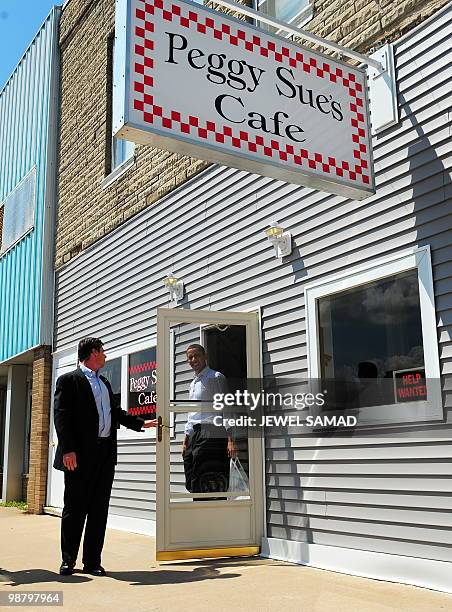 President Barack Obama walks out after buying lunch at Peggy Sue's Cafe in Monroe City, Missouri, on April 28, 2010. Obama said on April 27 that the...