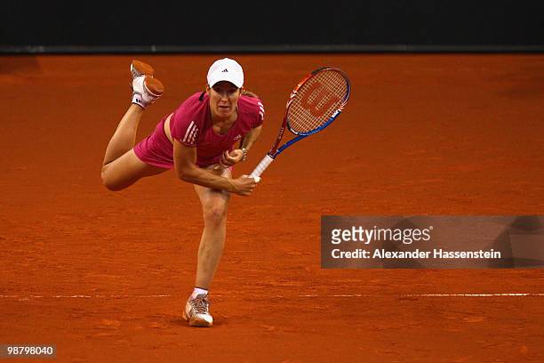 Justine Henin of Belgium serves during her final match against Samantha Stosur of Australia at the final day of the WTA Porsche Tennis Grand Prix...