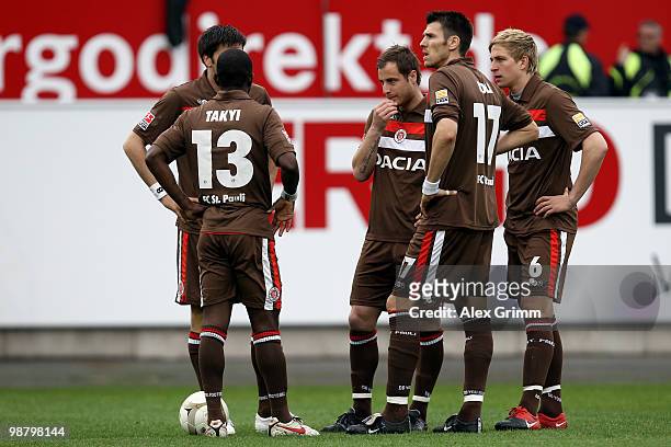 Charles Takyi, Matthias Lehmann, Fabian Boll and Bastian Oczipka of St. Pauli prepare for a free-kick during the Second Bundesliga match between...