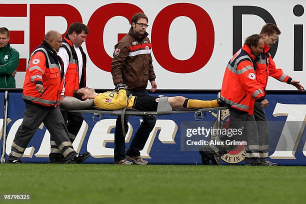 Goalkeeper Mathias Hain of St. Pauli is carried off the pitch during the Second Bundesliga match between SpVgg Greuther Fuerth and FC St. Pauli at...