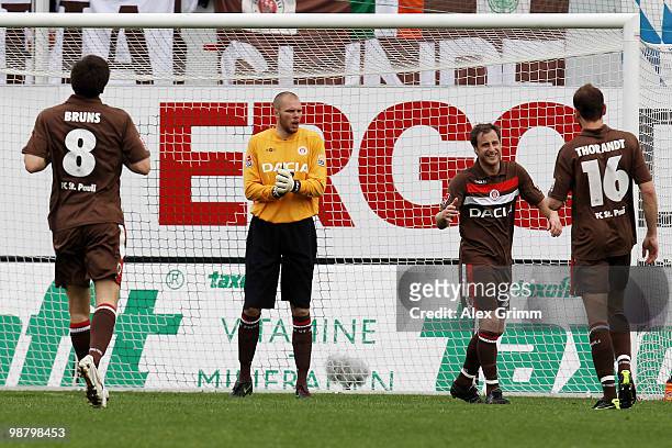 Florian Bruns, goalkeeper Benedikt Pliquett, Matthias Lehmann and Markus Thorandt of St. Pauli react during the Second Bundesliga match between SpVgg...