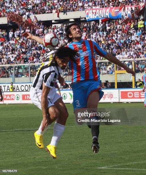 Nicolas Spolli of Catania Calcio competes for the ball with Amauri Carvalho de Oliveira of Juventus FC during the Serie A match between Catania and...