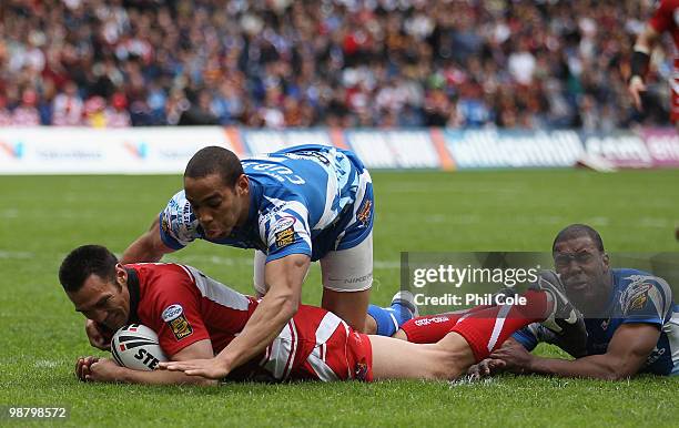 George Carmont of Wigan Warriors scores a try against Huddersfield Giants during the Engage Rugby Super League Magic Weekend match between Wigan...