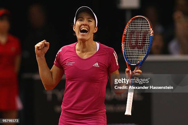 Justine Henin of Belgium celebrates victory after winning her final match against Samantha Stosur of Australia at the final day of the WTA Porsche...