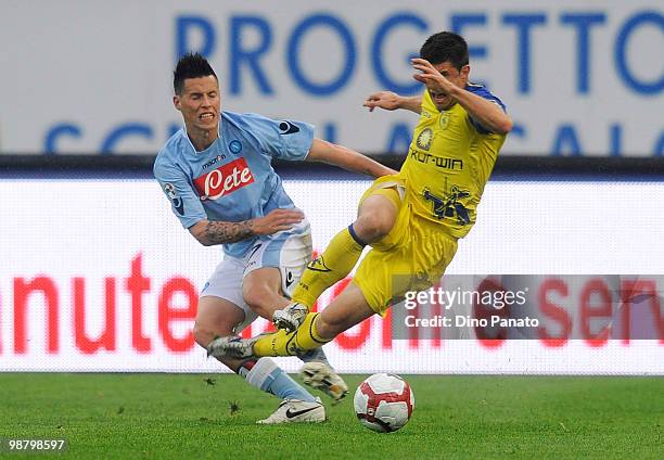 Marek Hamsik of Napoli competes with Bojan Jokic of Chievo during the Serie A match between Chievo and Napoli at Stadio Marc'Antonio Bentegodi on May...