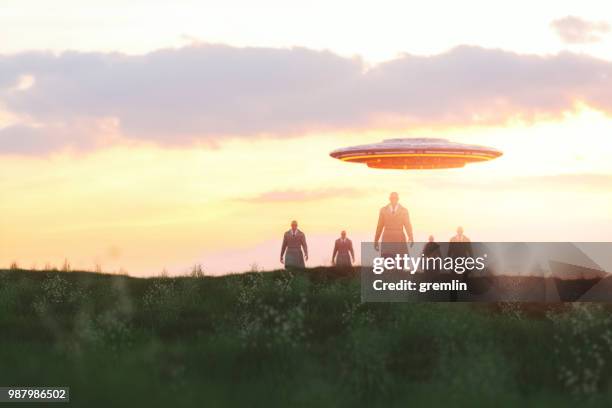 alien invasion at sunset - invader stock pictures, royalty-free photos & images