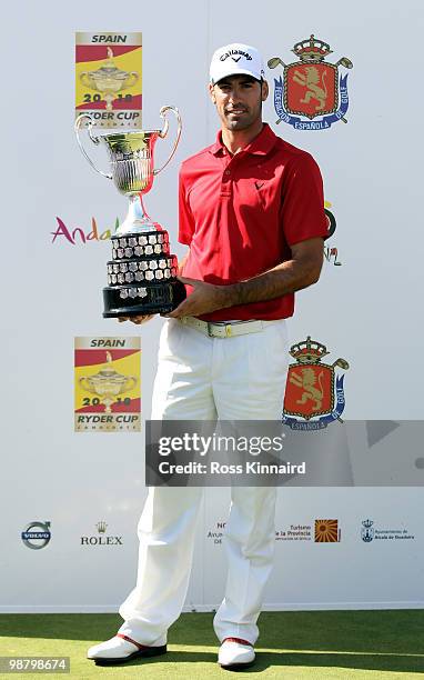 Alvaro Quiros of Spain with the winners trophy after the final round of the Open de Espana at the Real Club de Golf de Seville on May 2, 2010 in...