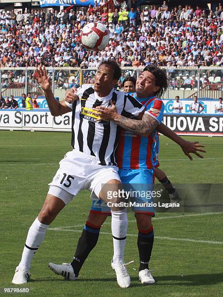 Pablo Alvarez of Catania Calcio competes for the ball with Jonathan Zebina of Juventus FC during the Serie A match between Catania and Juventus at...
