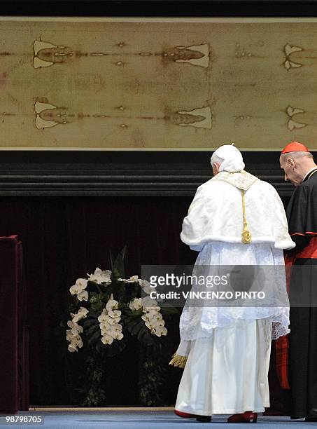 Pope Benedict XVI stands in front of the Shroud in the Turin cathedral on May 2, 2010. Pope Benedict XVI will bow before the Shroud of Turin, the...
