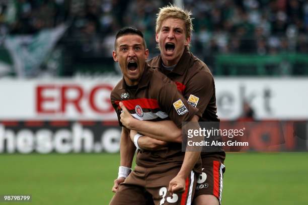 Deniz Naki of St. Pauli celebrates his team's first goal with team mate Bastian Oczipka during the Second Bundesliga match between SpVgg Greuther...