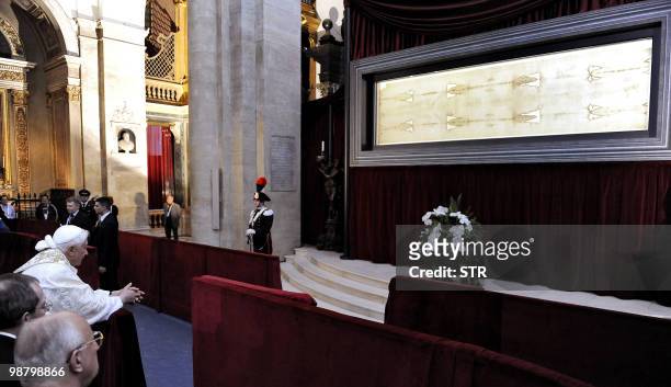 Pope Benedict XVI prays in front of the Shroud in the Turin cathedral on May 2, 2010. Pope Benedict XVI will bow before the Shroud of Turin, the...