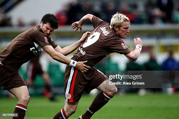 Marius Ebbers of St. Pauli celebrates his team's third goal with team mate Fabian Boll during the Second Bundesliga match between SpVgg Greuther...