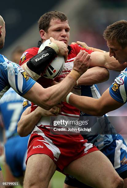 Stuart Fielden of Wigan Warriors struggles to get away during the Engage Super League game between Wigan Warriors and Huddersfield Giants at...