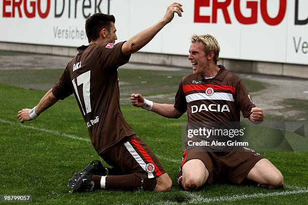 Marius Ebbers of St. Pauli celebrates his team's third goal with team mate Fabian Boll during the Second Bundesliga match between SpVgg Greuther...