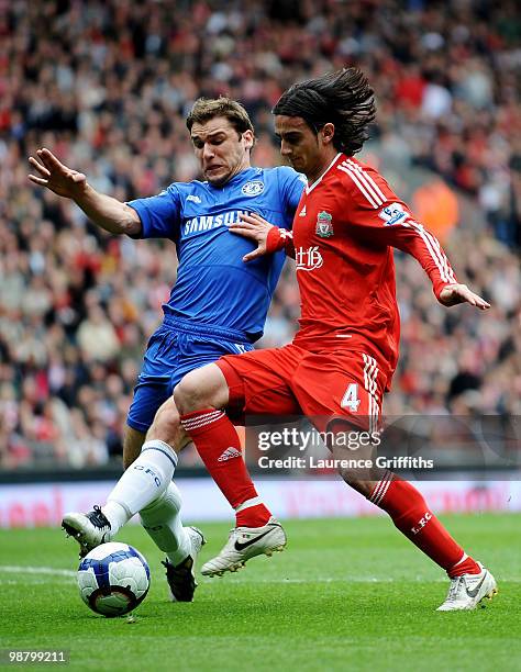 Branislav Ivanovic of Chelsea and Alberto Aquilani of Liverpool compete for the ball during the Barclays Premier League match between Liverpool and...