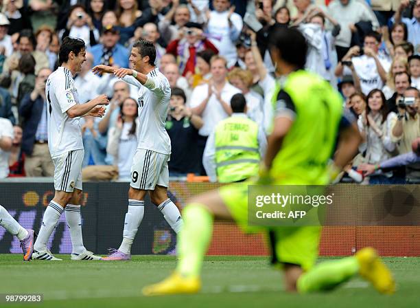 Real Madrid's Portuguese forward Cristiano Ronaldo celebrates with teammate Brazilian midfielder Kaka after scoring againt Osasuna during their...