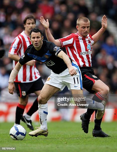 Ryan Giggs of Manchester United beats Lee Cattermole of Sunderland during the Barclays Premier League match between Sunderland and Manchester United...