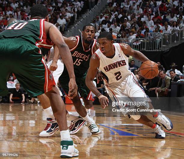 Joe Johnson of the Atlanta Hawks drives against John Salmons of the Milwaukee Bucks in Game Seven of the Eastern Conference Quarterfinals during the...