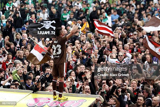 Deniz Naki of St. Pauli celebrates with supporters after winning the Second Bundesliga match between SpVgg Greuther Fuerth and FC St. Pauli at the...