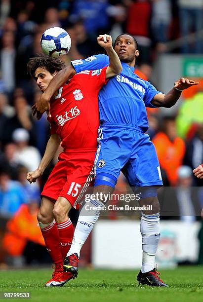 Yossi Benayoun of Liverpool and Didier Drogba of Chelsea battle for the ball during the Barclays Premier League match between Liverpool and Chelsea...