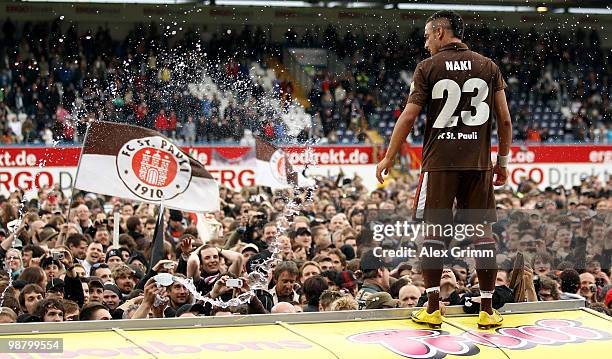 Deniz Naki of St. Pauli celebrates with supporters after winning the Second Bundesliga match between SpVgg Greuther Fuerth and FC St. Pauli at the...