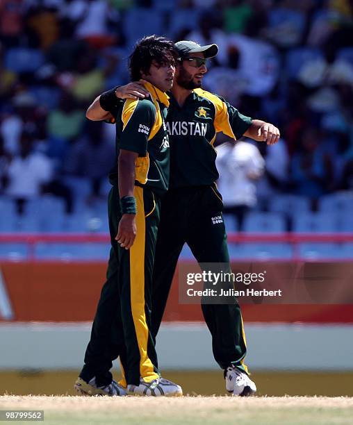 Shahid Afridi and Mohammad Sami of Pakistan celebrate David Warners disnmissal during The ICC World Twenty20 Group A match between Pakistan and...