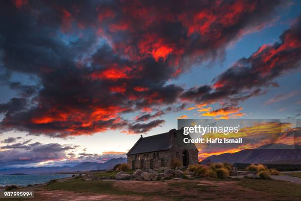 red sky at church of the good shepherd - good shepherd stock pictures, royalty-free photos & images