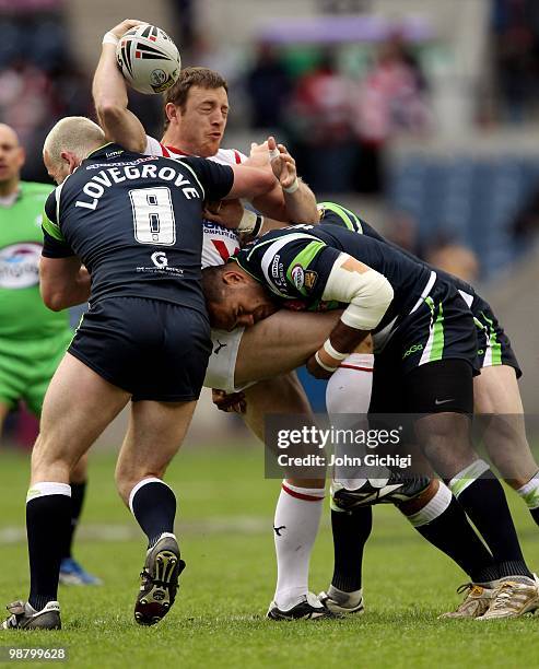 James Roby of St.Helens is tackled by the Hull Kingston Rovers defence during the Engage Super League game between St.Helens and Hull KR at...