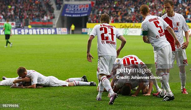 Jens Hegeler of Augsburg celebrates with his team mates after scoring 1-0 during the Second Bundesliga match between FC Augsburg and TSV 1860...