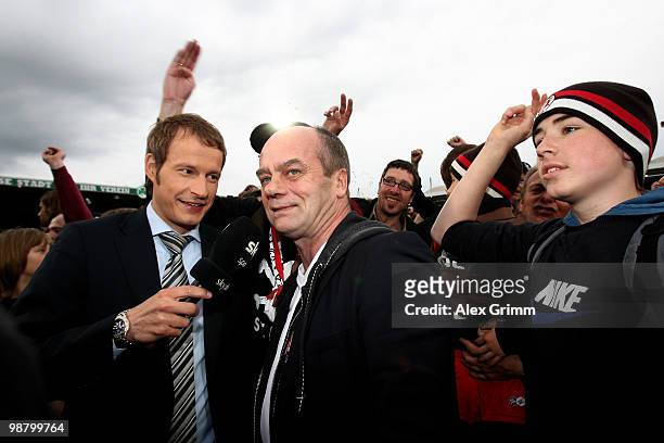 President Corny Littmann of St. Pauli is surrounded by supporters and media after the Second Bundesliga match between SpVgg Greuther Fuerth and FC...