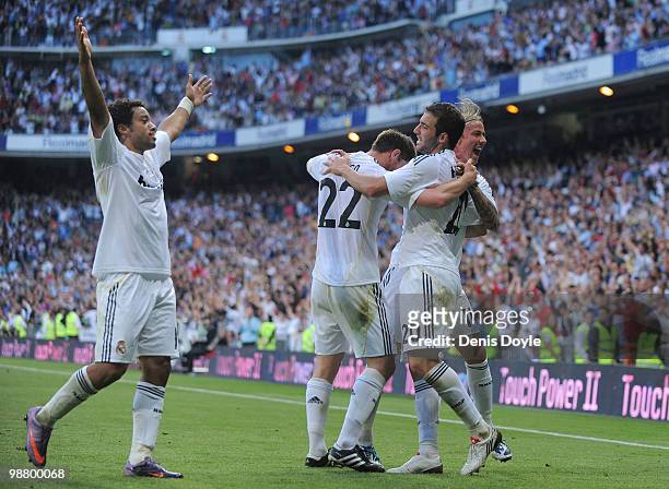 Marcelo ,Xabi Alonso Gonzalo Higuain and Guti of Real Madrid celebrate after Real scored their 3rd goal during the La Liga match between Real Madrid...