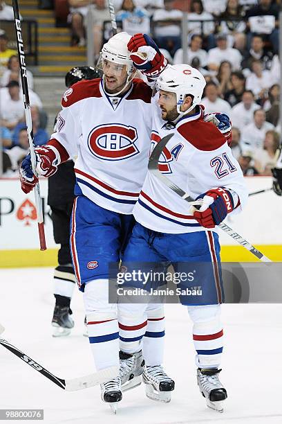 Benoit Pouliot of the Montreal Canadiens and Brian Gionta of the Montreal Canadiens celebrate Gionta's goal against the Pittsburgh Penguins in the...